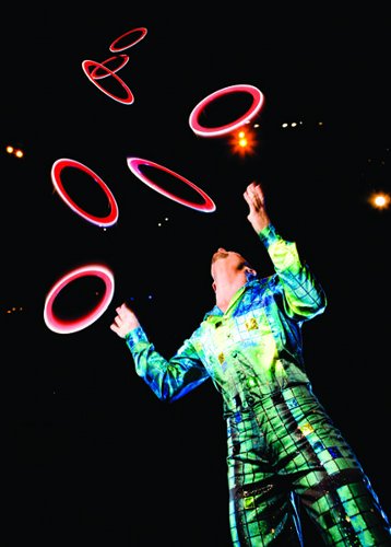 [Image: Anthony Gatto performing in Cirque du Soleil's La Nouba (]